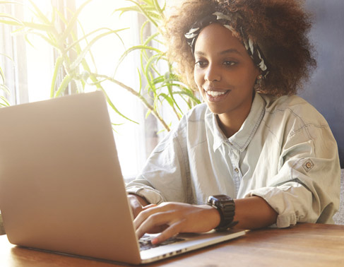 Graduate Using Laptop